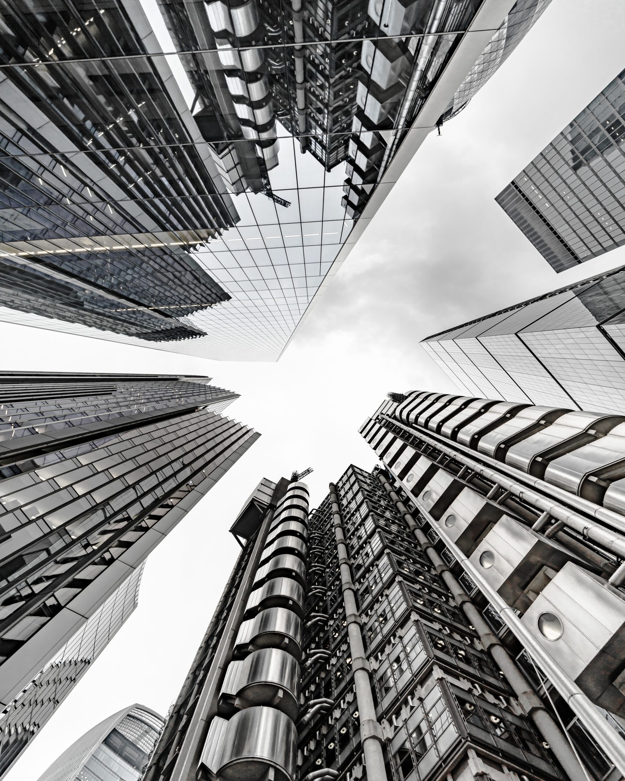 Vertical low angle shot of a modern business building scenery touching the sky